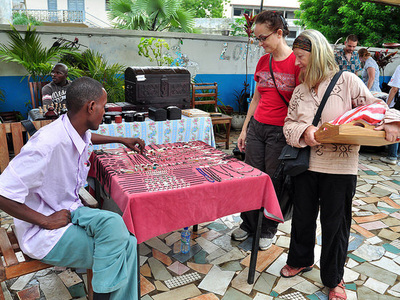 local vendors sell their handmade goods at a peace corps sponsored market in togo