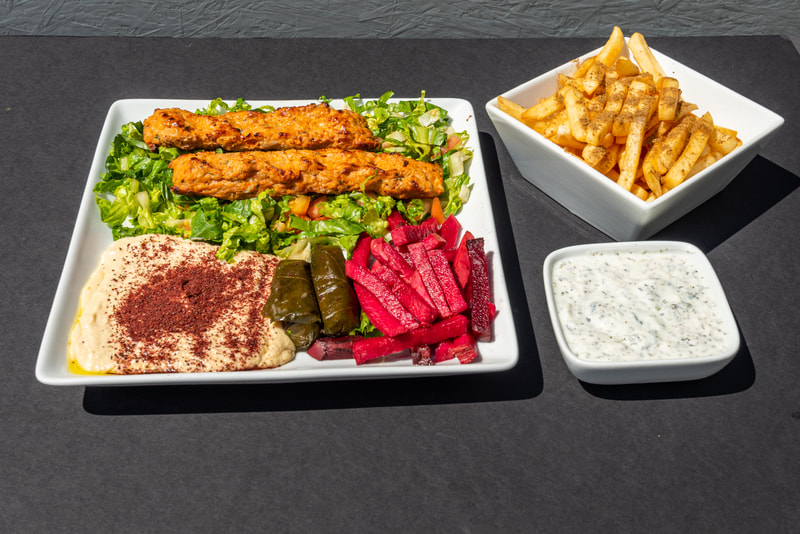 The chicken kabob plate from Ameera with yogurt and french fries