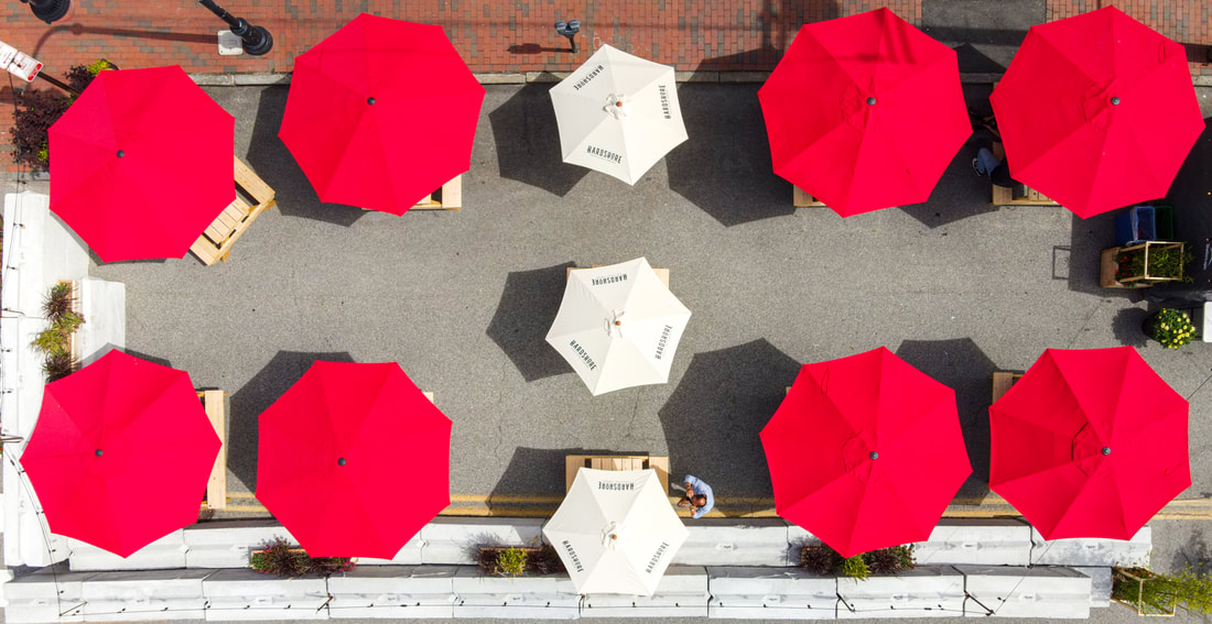 aerial images of The Honey Paw's red umbrellas